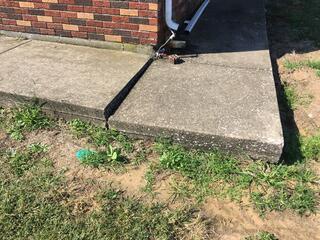Sinking Concrete Sidewalk