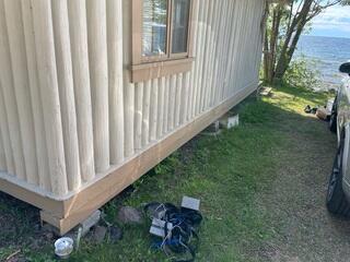 Before: Settling Cabin Near Lake Shore