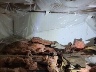 Insualting floor joists.