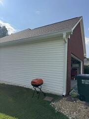 Gutters installed on the side of the home