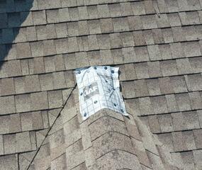 Emergency tarp installation after hail damage