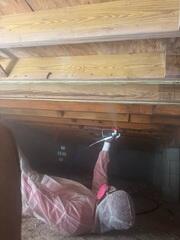 Applying LumkerKote to Floor Joists