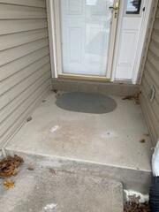 Technicians drilled small holes into the affected concrete slab and injected high-density polyurethane foam beneath the surface.