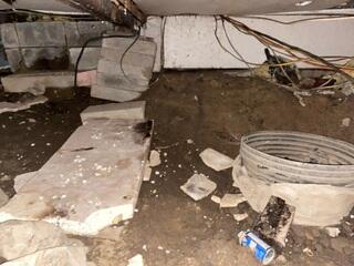 Before installation, the home relied on stacked concrete blocks and debris for support - an unsafe setup prone to shifting and collapse. These failing supports contributed to uneven floors and ongoing instability.