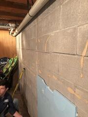 A failing block wall inside the cabin showed horizontal cracking and signs of movement-clear indicators that the foundation needed structural stabilization.