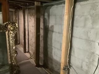 Basement with Moisture and Foundation Cracks