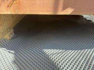 Drainage matting was laid down to remove any standing water or puddles.