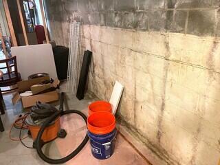 Signs of water intrusion were present when the specialist went to inspect the home. Efflorescence, which is a white chalky substance, could be seen left behind on the walls after the minerals in the concrete blocks dissolved and the water evaporated off the surface.