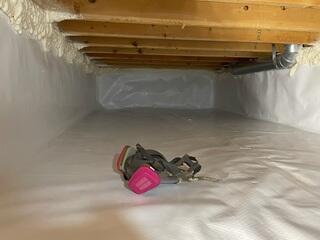 The final result shows a fully encapsulated crawlspace enhanced with spray foam at key joints for optimal energy efficiency. The CleanSpace® liner provides long-lasting protection against odors, moisture, and mold.