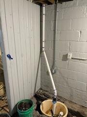 The HomeSpec team had begun installing a TripleSafe™ sump pump system to ensure protection against water leakage.