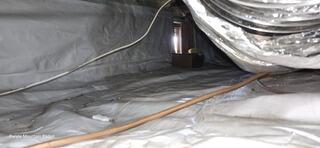 One of four crawlspaces beneath the structure