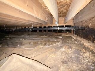 Before Installation - Loose, Flimsy Crawl Space Liner