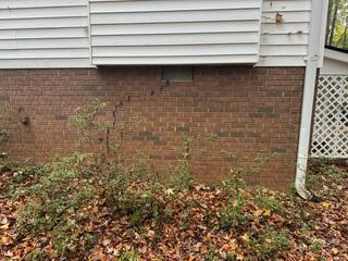 As you can see, the corner of the home is sinking which has caused the crack in the brick.