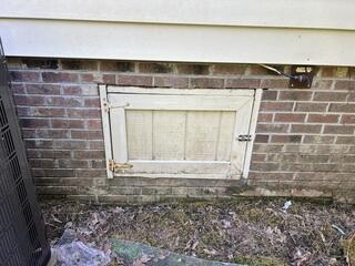 Assessing the Old, Weathered Crawl Space Access Door - Chapel Hill, NC