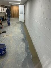 The WaterGuard XL drainage system is covered, leaving a cleaner look in the basement.