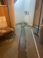 The WaterGuard™ system collects water that seeps through basement walls and drains it to your sump pump.