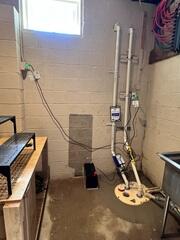 TripleSafe sump pump was installed in the corner of the basement to provide three levels of protection with support even through heavy rains and power outages.