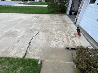 Concrete Driveway in need of leveling and repair