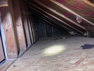 There was no insulation in this knee wall, which was allowing outside air to filter in.