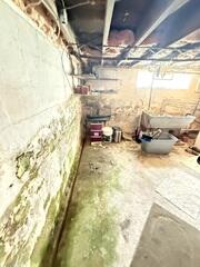 Water seeping into Synthia's basement had led to severe damage to the walls and floors. The space had also started to develop a musty odor that lingered not only in it but was making its way up into her home!