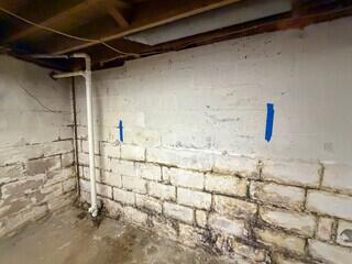 Before Geneseo, IL Bowing Wall Repair