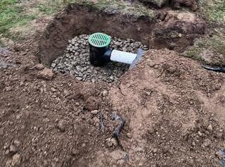 LawnScape Outlet and Discharge line