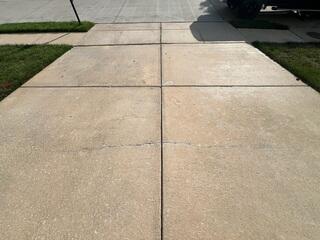 Cracked Concrete and Uneven Driveway