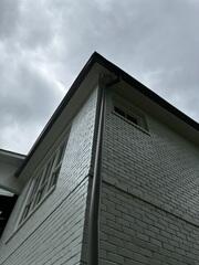 Strom-Damaged Open K-Stle Gutters in Chastain Park, GA