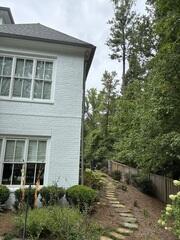 Downspout disconnected from side of home