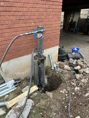 Installing Push Piers for Foundation Stabilization