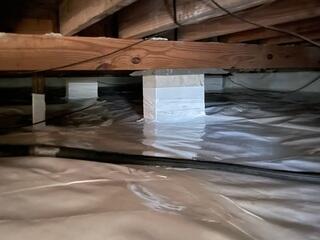 Sealing Crawl Space with Moisture Barrier