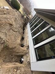 Installing Helical Piers for Foundation Stabilization