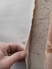 Fastened and sealed to wall