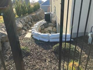 Temporary Sandbag Flood Protection Before Basement Waterproofing in Lehi, UT