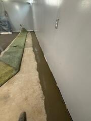 Interior Drainage System Sealed Within Basement Floor