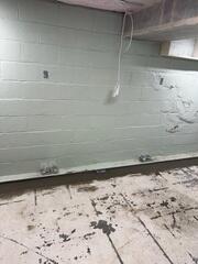 Basement Drainage Systems Cemented into Foundation