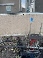 Stabilizing Foundation with Helical Piers