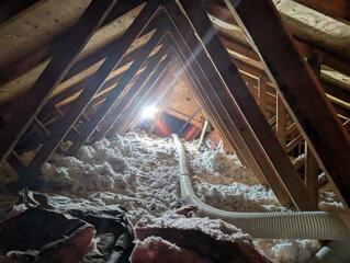 Mice and Squirrel activity created a hostile attic environment. This insulation was dirty and needed taken out to improve the health of the home.