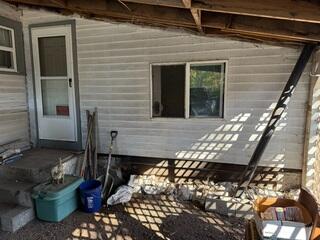 Before Photo of Crumbling Foundation Held Up With Sand Bags