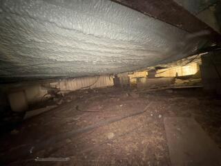 Insulated belly of a mobile home in Candor, NY