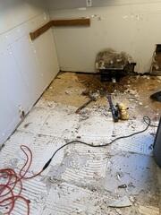 Once the flooring was removed, the true extent of the damage became visible. Years of excess moisture had led to wood rot and deterioration along the wall and subfloor area. What may have seemed like a minor issue on the surface was actually structural damage developing underneath. Identifying the source is the first step toward restoring strength and stability to the home.