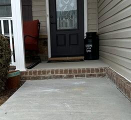 After the PolyLyft&trade; process, the concrete walkway was lifted and stabilized, restoring a more even and secure entryway for the homeowner.