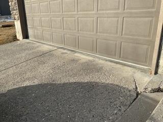 Driveway Settlement Near Garage Door in Midway UT