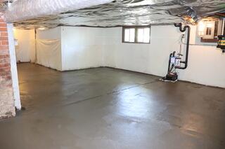 Finished Concrete Basement Floor With WaterGuard Perimeter Drainage System