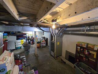 Weak beams in this basement were causing the floors in the home to sag.