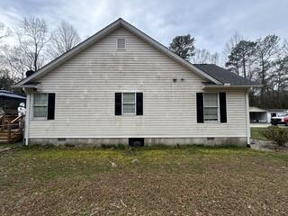 Before soft washing, the vinyl siding on this home was covered in mildew, leaving the exterior looking unsightly.