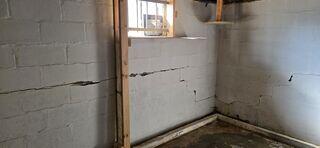 Identifying a Large Foundation Wall Crack Requiring Wall Anchors