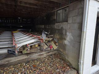 The corner of this garage's foundation was beginning to sink.