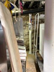 Radon Mitigation System with Bubbler Prep Installed in Oxford Farmhouse