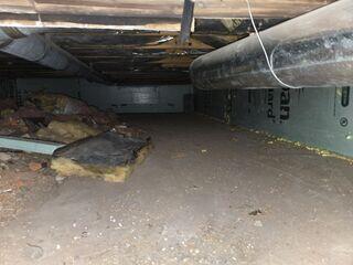This crawl space was full of debris. The owner wanted it to be encapsulated.